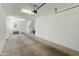 Spacious and well-lit three car garage with ample storage space at 1679 E Dogwood Ln, Gilbert, AZ 85295