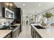Stylish kitchen with stainless steel appliances, an island and breakfast bar at 1679 E Dogwood Ln, Gilbert, AZ 85295