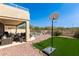 Inviting backyard featuring a refreshing pool, lush turf, and a relaxing covered patio, ideal for outdoor enjoyment at 17005 S Coleman St, Phoenix, AZ 85045