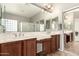 Bright bathroom with dual sinks, large mirror, and modern fixtures at 17005 S Coleman St, Phoenix, AZ 85045