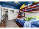 bedroom with carpeted floors, a bunk bed, and a decorative blue ceiling at 17005 S Coleman St, Phoenix, AZ 85045