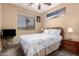 Cozy bedroom featuring a bed with blue decorative pillows and a television at 17005 S Coleman St, Phoenix, AZ 85045
