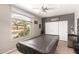 Neutral toned bedroom features a large window and a covered pool table at 17005 S Coleman St, Phoenix, AZ 85045
