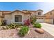 Attractive home featuring desert landscaping, decorative rocks, and well-manicured shrubs, adding to its charm at 17005 S Coleman St, Phoenix, AZ 85045