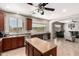 Kitchen with center island, dark cabinets, stainless steel appliances, and breakfast bar at 17005 S Coleman St, Phoenix, AZ 85045