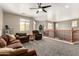 Upstairs living room featuring a ceiling fan, carpeted floor, and beautiful views at 17005 S Coleman St, Phoenix, AZ 85045