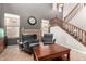 Bright living room featuring a staircase, fire place, tile floors and high ceilings at 17005 S Coleman St, Phoenix, AZ 85045