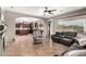 Open living room featuring tile floors, ceiling fan and access to the kitchen at 17005 S Coleman St, Phoenix, AZ 85045