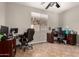 This office space offers tile floors, a ceiling fan and a large window at 17005 S Coleman St, Phoenix, AZ 85045
