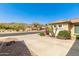 Charming street view showcasing desert landscaping, a spacious driveway, and a well-maintained home with a tiled roof at 17005 S Coleman St, Phoenix, AZ 85045
