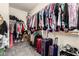 Walk-in closet with organized shelving and plenty of storage space at 17005 S Coleman St, Phoenix, AZ 85045