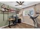 Comfortable bedroom with a dedicated workspace and treadmill for fitness at 1715 W Carol Ave, Mesa, AZ 85202