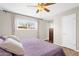 Serene bedroom with soft natural light, neutral paint, and wood-look floors, creating a peaceful retreat at 1715 W Carol Ave, Mesa, AZ 85202