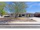 Charming single-story home with mature trees, low-maintenance landscaping, and a welcoming facade in a desirable neighborhood at 1715 W Carol Ave, Mesa, AZ 85202