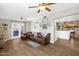 Inviting living room features wood floors, comfortable seating, and sliding doors to the backyard at 1715 W Carol Ave, Mesa, AZ 85202