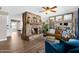 Inviting living room featuring a stone fireplace, comfortable seating, and stylish decor, creating a cozy atmosphere at 1715 W Carol Ave, Mesa, AZ 85202