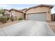 Charming one-story home featuring a spacious three-car garage and low maintenance desert landscaping at 17545 W Lilac St, Goodyear, AZ 85338