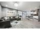 Open floorplan showcasing the living room and kitchen with seamless flow and ample natural light at 17545 W Lilac St, Goodyear, AZ 85338