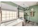 The renovated primary bathroom features a glass shower enclosure and stylish tile work at 2167 E Aspen Dr, Tempe, AZ 85282