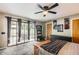 Lovely primary bedroom boasts doors to patio, neutral paint and a stylish ceiling fan at 2167 E Aspen Dr, Tempe, AZ 85282