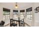 Cozy breakfast nook features a ceiling fan, natural light and stylish tile flooring at 2167 E Aspen Dr, Tempe, AZ 85282