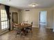 Cozy dining room with wooden table, tile floors, and abundant natural light at 2167 E Aspen Dr, Tempe, AZ 85282