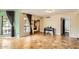 Open living space with tile floors, neutral paint, and an open doorway to a bedroom at 2167 E Aspen Dr, Tempe, AZ 85282