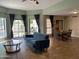 Inviting living room flows into dining area, featuring tile floors and large windows at 2167 E Aspen Dr, Tempe, AZ 85282