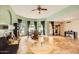 Spacious living area with tile floors, fireplace, furniture, and plentiful natural light at 2167 E Aspen Dr, Tempe, AZ 85282