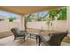 Cozy covered patio features outdoor seating, creating a relaxing space for entertaining or enjoying the outdoors at 2167 E Aspen Dr, Tempe, AZ 85282