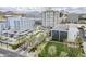 Aerial shot of the community with lush greenery, ample parking, and views of surrounding buildings at 2211 E Camelback Rd # 605, Phoenix, AZ 85016