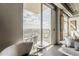 Comfortable living space that opens onto a private balcony with scenic city views through large sliding glass doors at 2211 E Camelback Rd # 605, Phoenix, AZ 85016