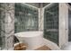 Spa-like bathroom equipped with a modern tub, elegant tiles, and sophisticated fixtures for a serene bathing experience at 2211 E Camelback Rd # 605, Phoenix, AZ 85016