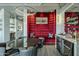 Dining area with a modern dark table and a wine bar featuring stylish seating at 2211 E Camelback Rd # 605, Phoenix, AZ 85016