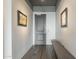 Inviting hallway with gray door, art, and a bench offers a stylish welcome at 2211 E Camelback Rd # 605, Phoenix, AZ 85016