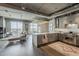 Modern kitchen open to the living room features stainless steel appliances and expansive city views at 2211 E Camelback Rd # 605, Phoenix, AZ 85016