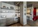 Modern kitchen with gray cabinets, white countertops, open shelving, and stainless steel appliances at 2211 E Camelback Rd # 605, Phoenix, AZ 85016