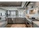 Contemporary kitchen featuring stainless steel appliances, a large island, and an open floor plan at 2211 E Camelback Rd # 605, Phoenix, AZ 85016