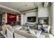 Stylish living room featuring a fireplace, a media center, and a nearby dining space at 2211 E Camelback Rd # 605, Phoenix, AZ 85016