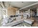 Open-concept living space with hardwood floors, comfortable sofa, and an adjacent dining area at 2211 E Camelback Rd # 605, Phoenix, AZ 85016