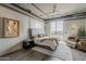 Beautifully appointed main bedroom with neutral tones, modern lighting, and a private balcony offering scenic views at 2211 E Camelback Rd # 605, Phoenix, AZ 85016