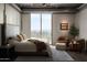 Serene main bedroom with balcony access offering city views and comfortable seating area at 2211 E Camelback Rd # 605, Phoenix, AZ 85016