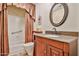 The bathroom boasts a tub/shower combo, a large vanity, and great lighting at 22521 N 60Th Ave, Glendale, AZ 85310