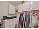 The closet is equipped with great cabinetry and shelving, making organization easy and storage abundant at 22521 N 60Th Ave, Glendale, AZ 85310