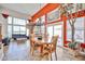 Bright dining room features large windows, tile flooring, and a decorative light fixture above a wooden table at 22521 N 60Th Ave, Glendale, AZ 85310