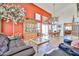 Spacious living room featuring high ceilings, an adjacent dining area, and stylish furnishings at 22521 N 60Th Ave, Glendale, AZ 85310