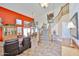Open-concept living space featuring high ceilings, a staircase, and a blend of modern and classic décor at 22521 N 60Th Ave, Glendale, AZ 85310