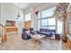 Elegant living room boasts soaring ceilings, large windows, and comfortable seating at 22521 N 60Th Ave, Glendale, AZ 85310