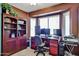 Dedicated office with built-in desk and shelving, providing a functional workspace at 22521 N 60Th Ave, Glendale, AZ 85310
