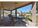 Covered patio featuring an outdoor dining area, perfect for enjoying the backyard views at 22521 N 60Th Ave, Glendale, AZ 85310